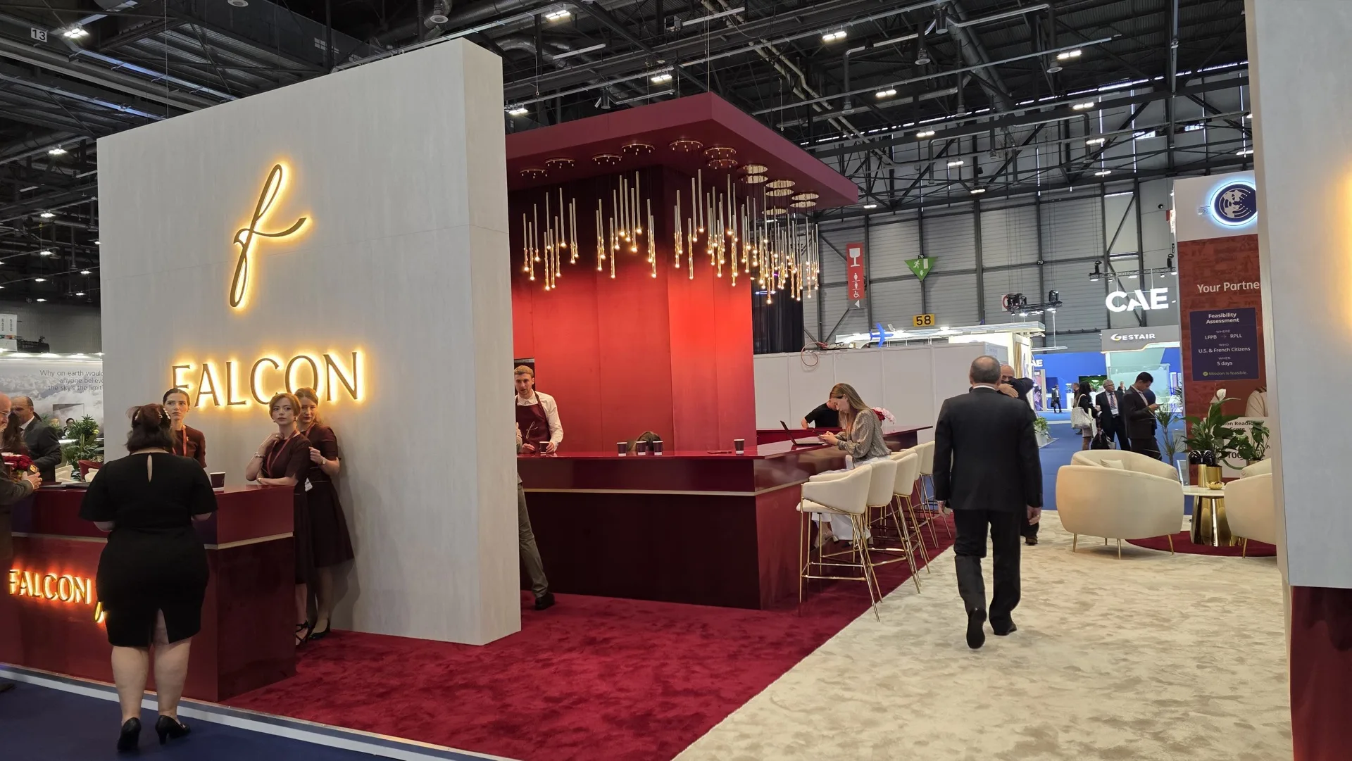 Falcon stand live show with visitors at the bar